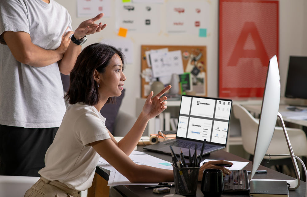 Group of asian web and graphic designers working in office, brain storming.